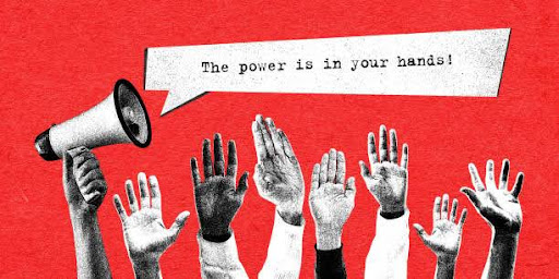 Raised hands and a megaphone saying “The power is in your hands!”